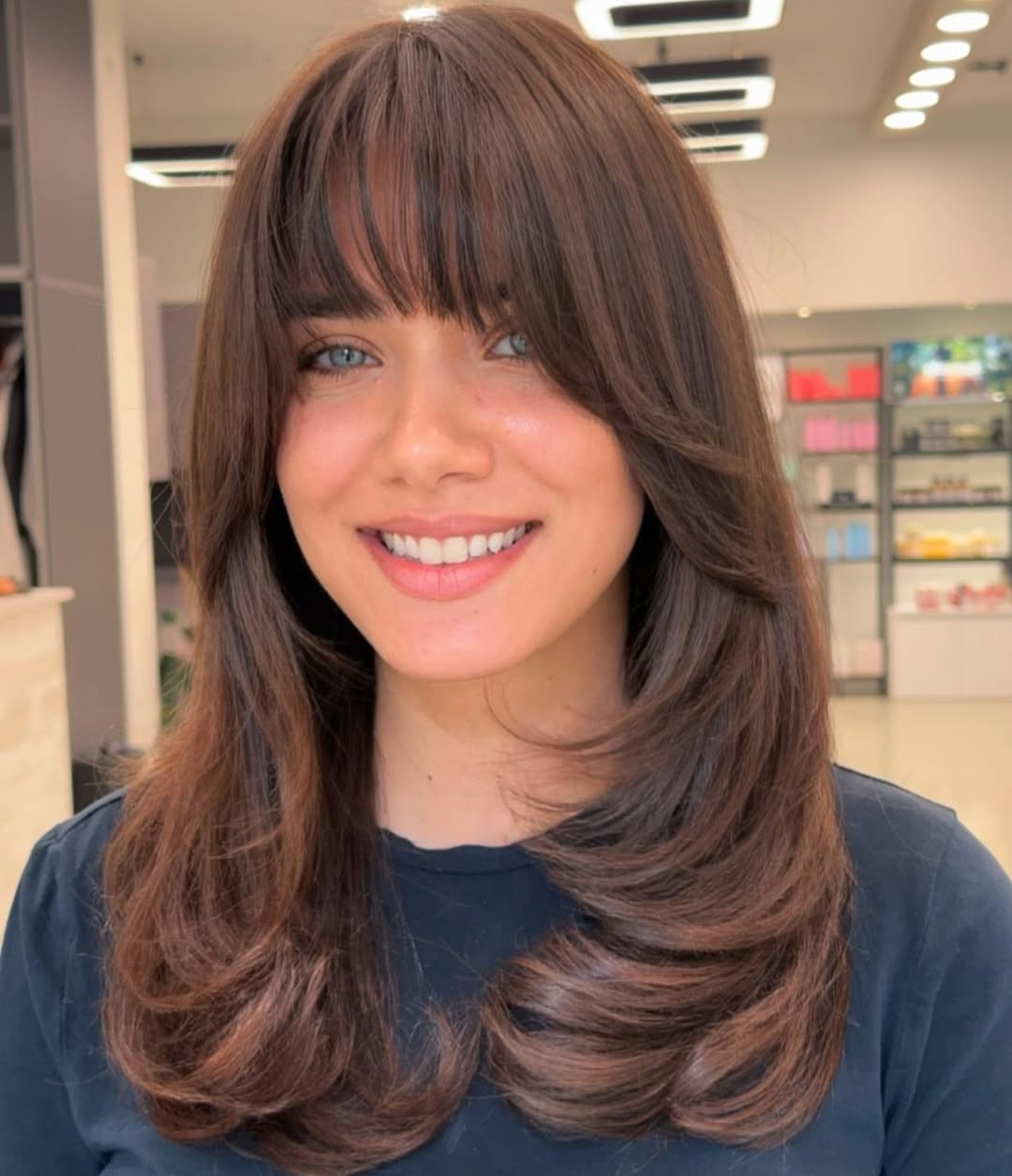 Butterfly Haircut with a Full Fringe