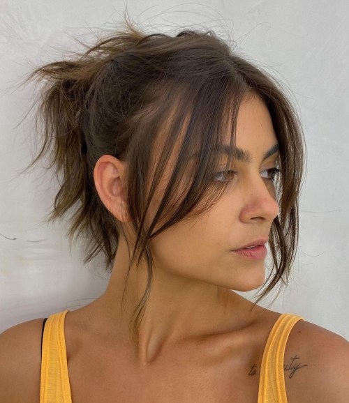 Messy Updo with Long Curtain Bangs