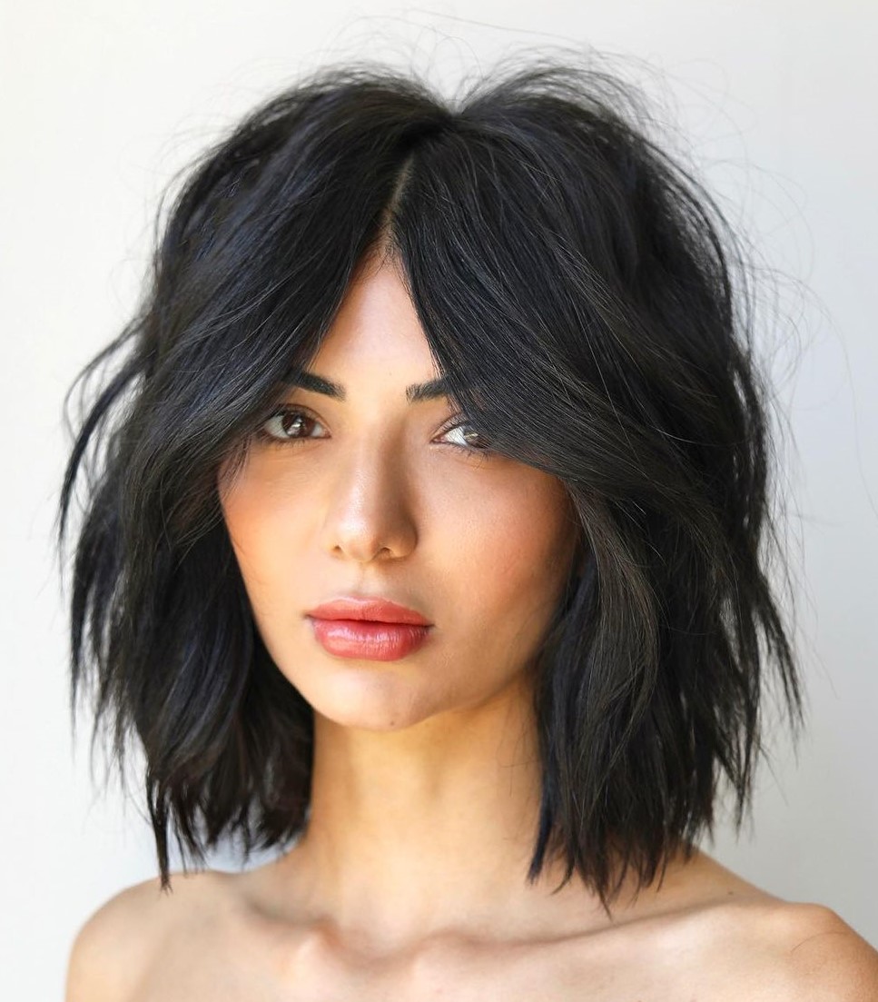 Short Choppy Layers and Middle Part Bangs