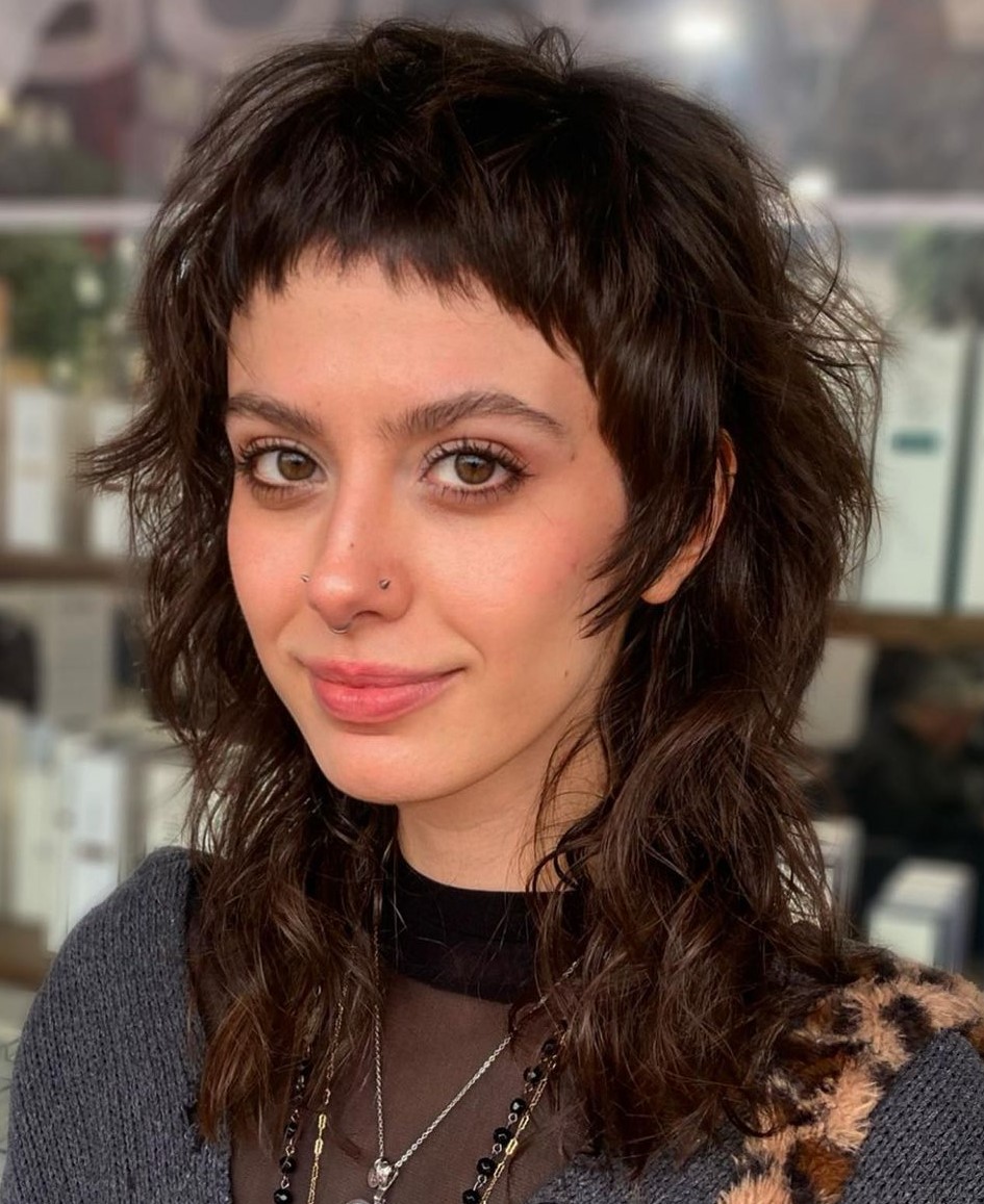 Choppy Curly Hairstyle with Baby Bangs