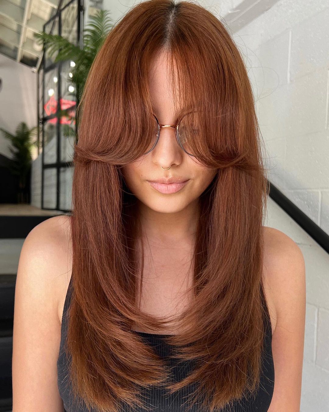Auburn Hair with Long Layers and Curtain Bangs