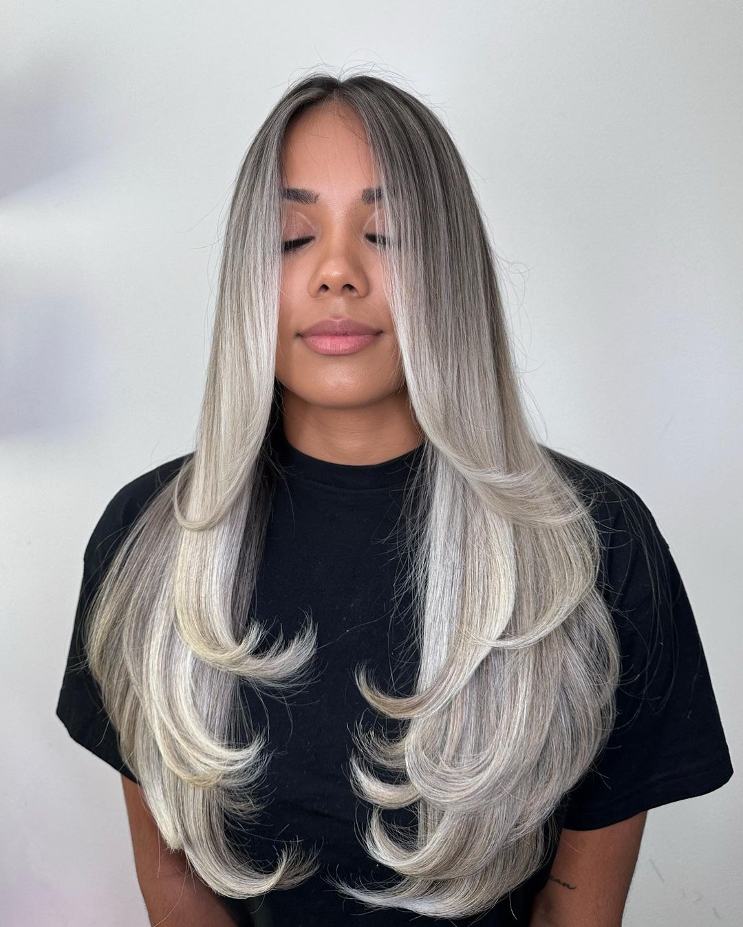 Icy Butterfly Cut with Dark Roots Platinum Butterfly Cut with Flipped Ends