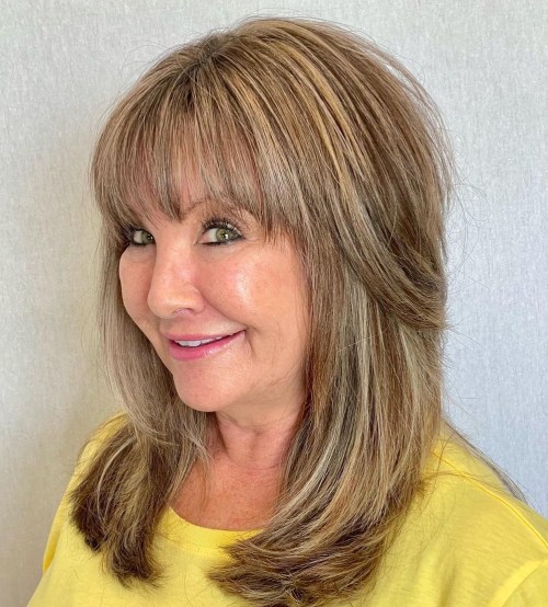 Collarbone Grazing Shag with Bangs Below the Shoulders Layered Hairstyle with Bangs
