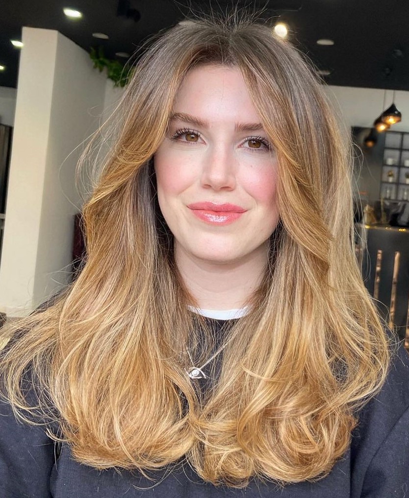 Feathered Layers and Light Strawberry Blonde Balayage